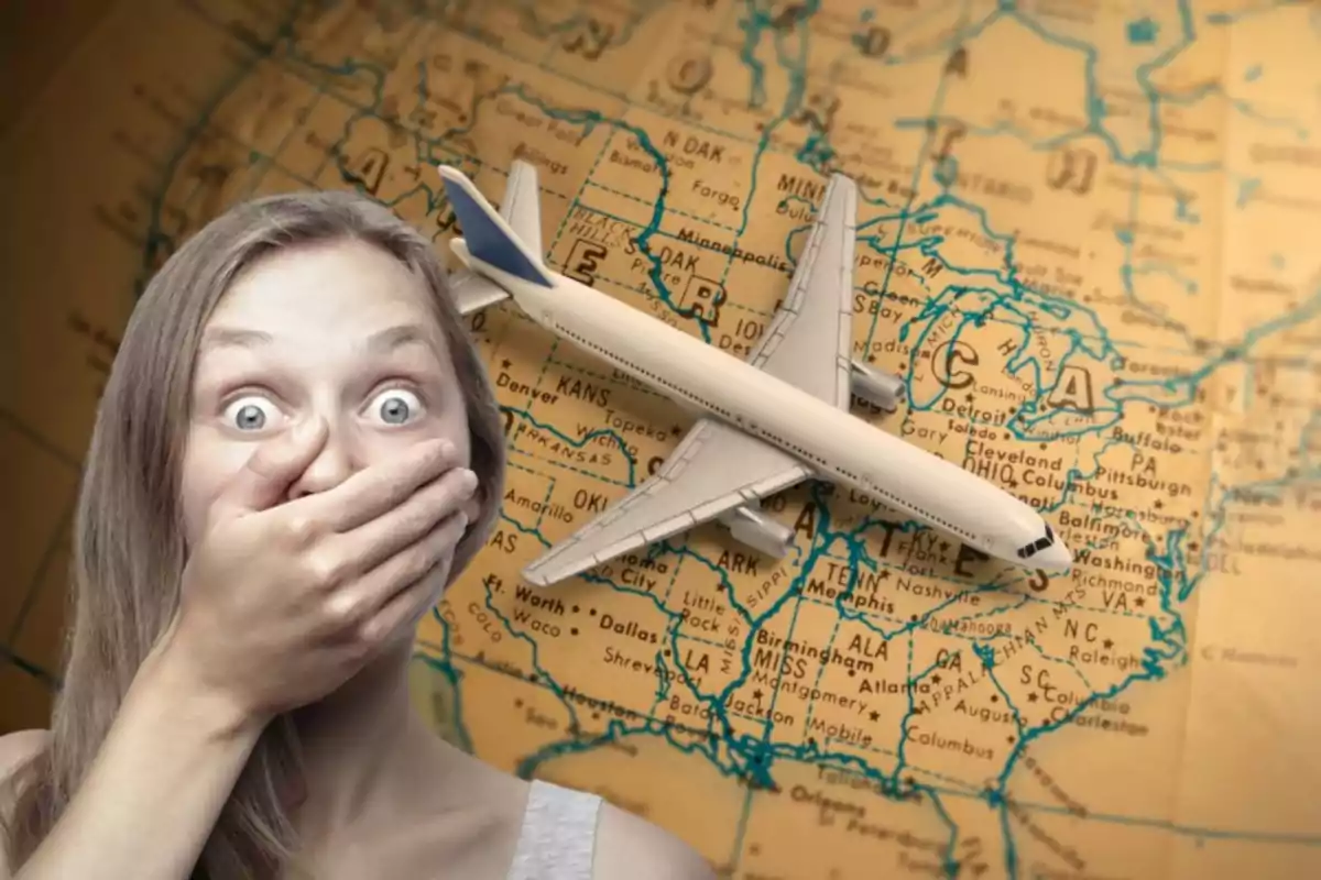 Surprised woman covering her mouth with her hand in front of an old map of the United States and a toy airplane