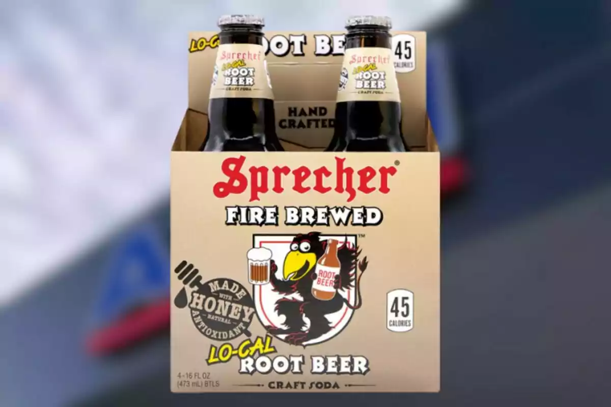 Four-pack of Sprecher Root Beer bottles featuring a design of a raven holding a bottle and a mug, highlighting that it is low in calories and made with honey Four-pack of Sprecher Root Beer bottles featuring a design of a raven holding a bottle and a mug, highlighting that it is low in calories and made with honey