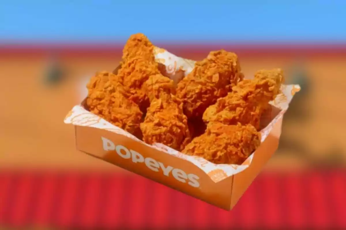 Crispy Popeyes fried chicken box on a blurred background Crispy Popeyes fried chicken box on a blurred background