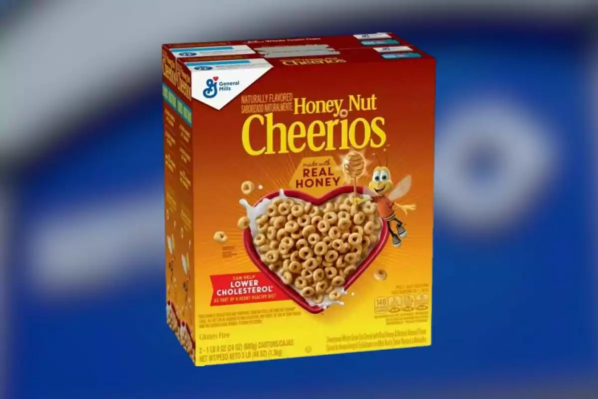 Caja de cereal Honey Nut Cheerios con diseño de abeja sonriente y tazón en forma de corazón lleno de cereal Caja de cereal Honey Nut Cheerios con diseño de abeja sonriente y tazón en forma de corazón lleno de cereal