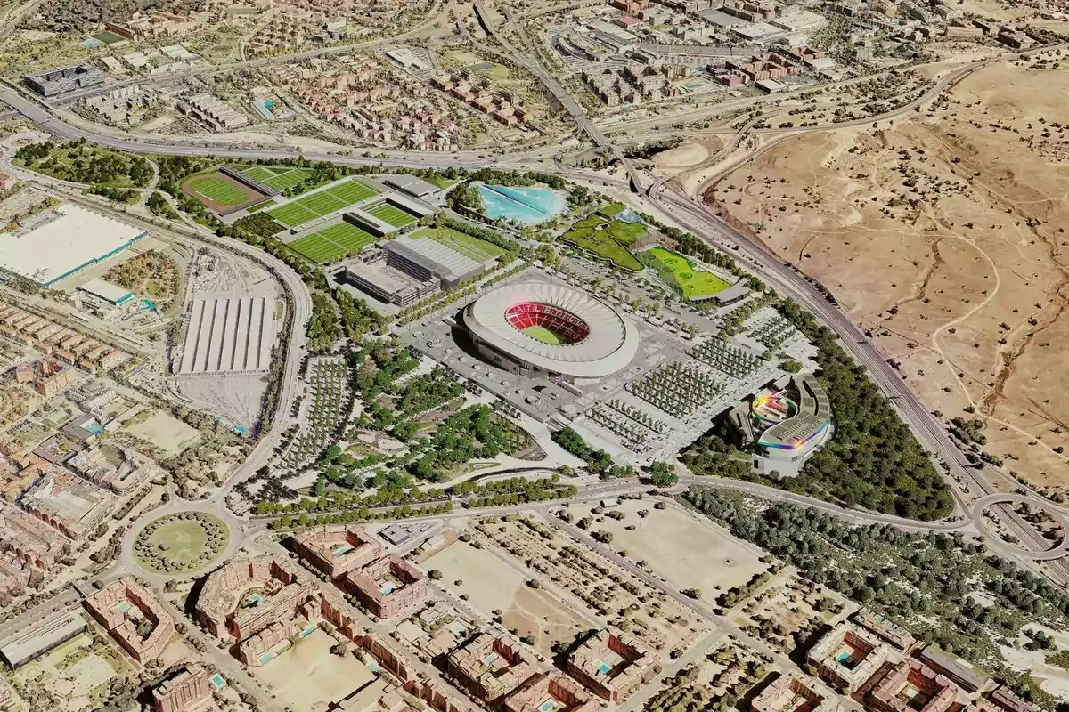 Vista aérea de un estadio rodeado de instalaciones deportivas, áreas verdes y zonas urbanas.