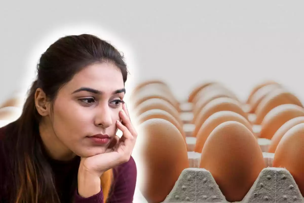 A thoughtful person looking at a tray of eggs.