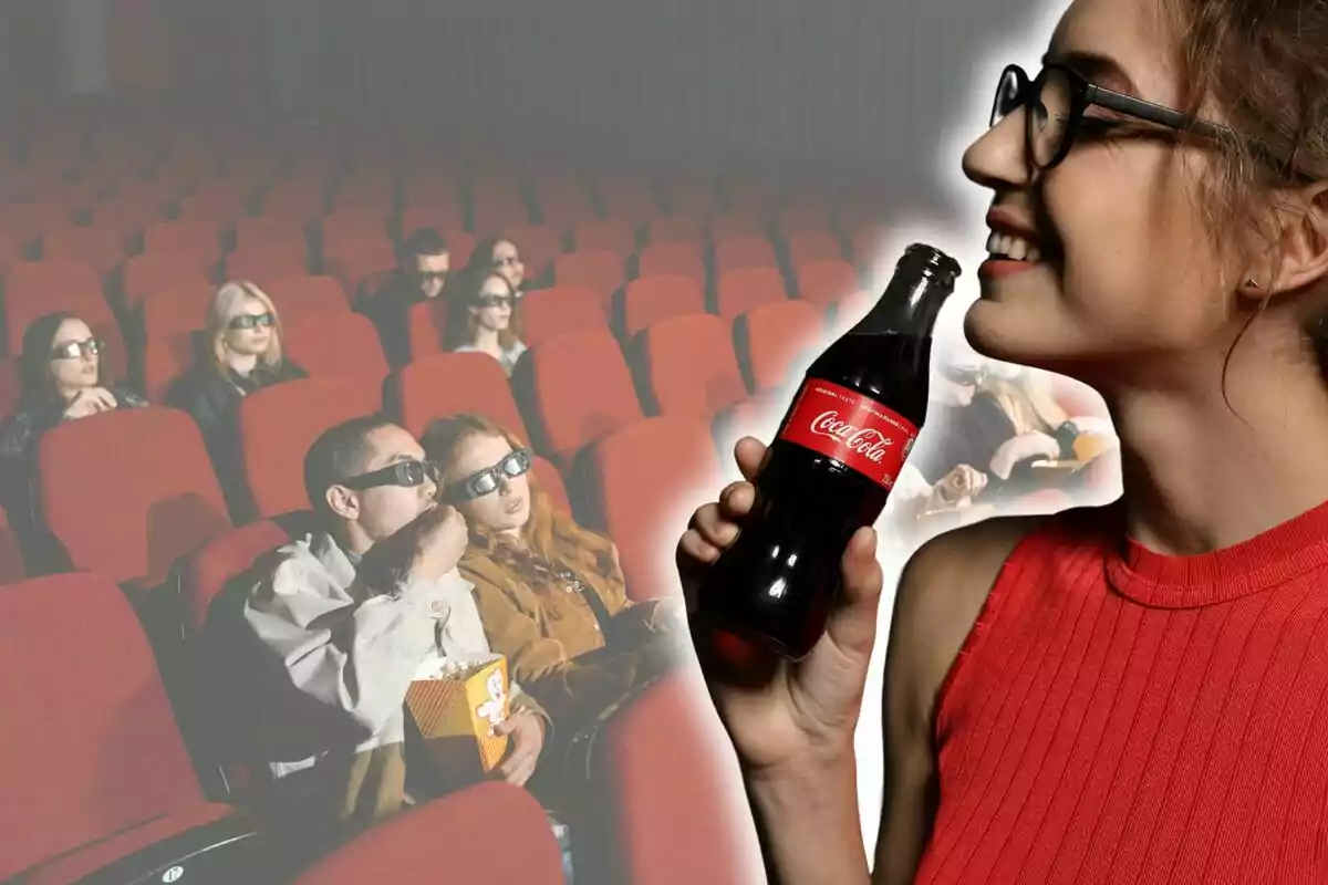 Smiling woman holding a bottle of Coca-Cola in front of a movie theater with people wearing 3D glasses and red seats. Smiling woman holding a bottle of Coca-Cola in front of a movie theater with people wearing 3D glasses and red seats.