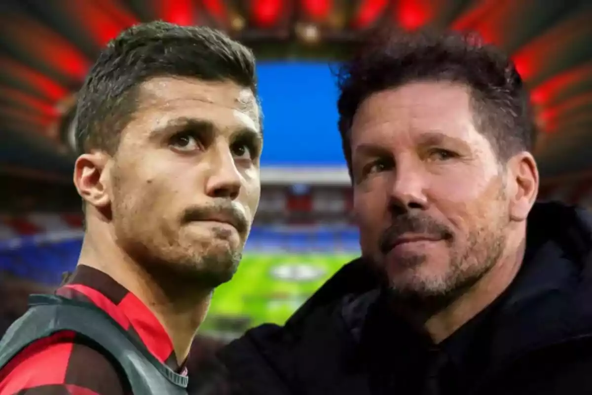 Two men looking in opposite directions with a soccer stadium in the background.