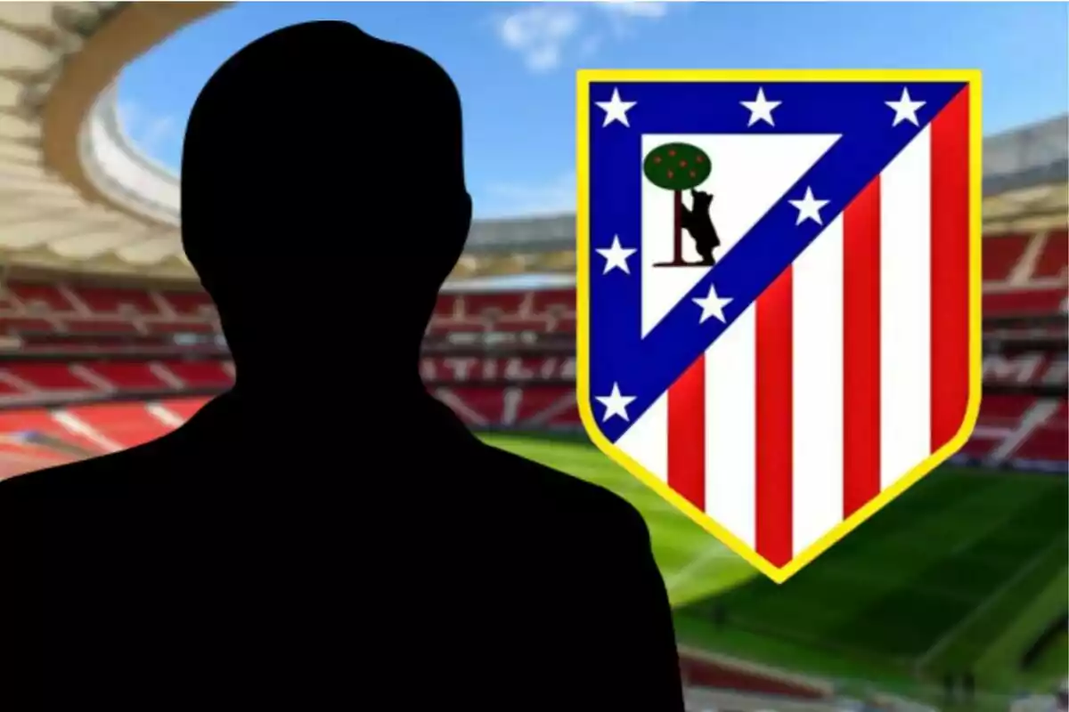 Silhouette of a person in front of Atlético de Madrid's crest in a soccer stadium.