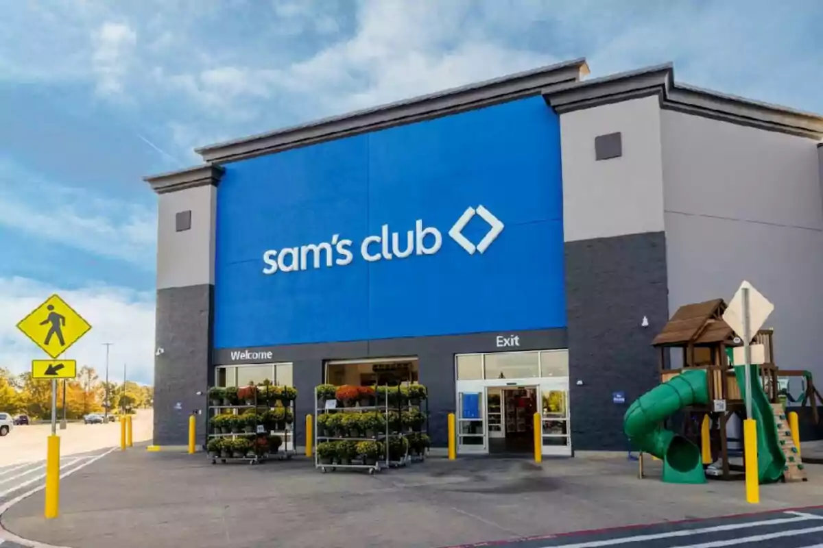 Facade of a Sam's Club store with a blue sign and a play area next to the entrance. Facade of a Sam's Club store with a blue sign and a play area next to the entrance.