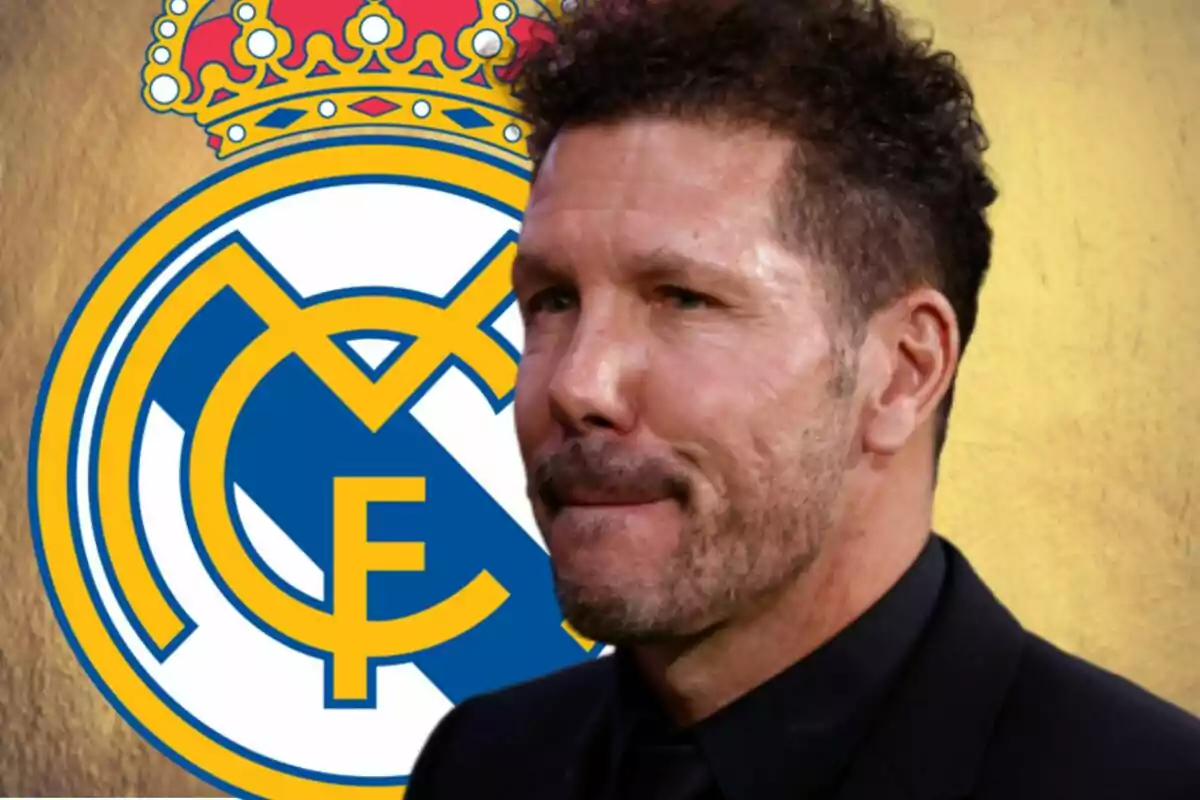 A man with a beard and curly hair is in front of a Real Madrid crest.