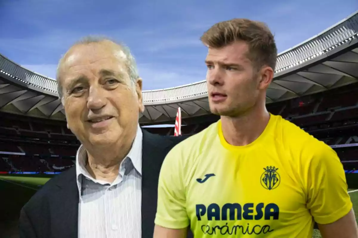 Dos hombres, uno mayor con traje y otro joven con camiseta amarilla de un equipo de fútbol, posan frente a un estadio.